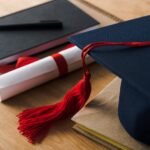 selective focus of notebooks with pen diploma and 3K7P2RQ Hotel Paradise DLX