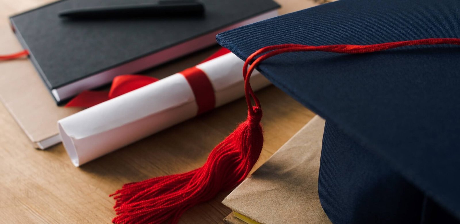 selective focus of notebooks with pen diploma and 3K7P2RQ Hotel Paradise DLX