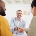 happy business people handshake and interview in m 6FPDS75 Hotel Paradise DLX