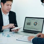 teamwork with business people analysis cost graph 3JFK4U7 Hotel Paradise DLX