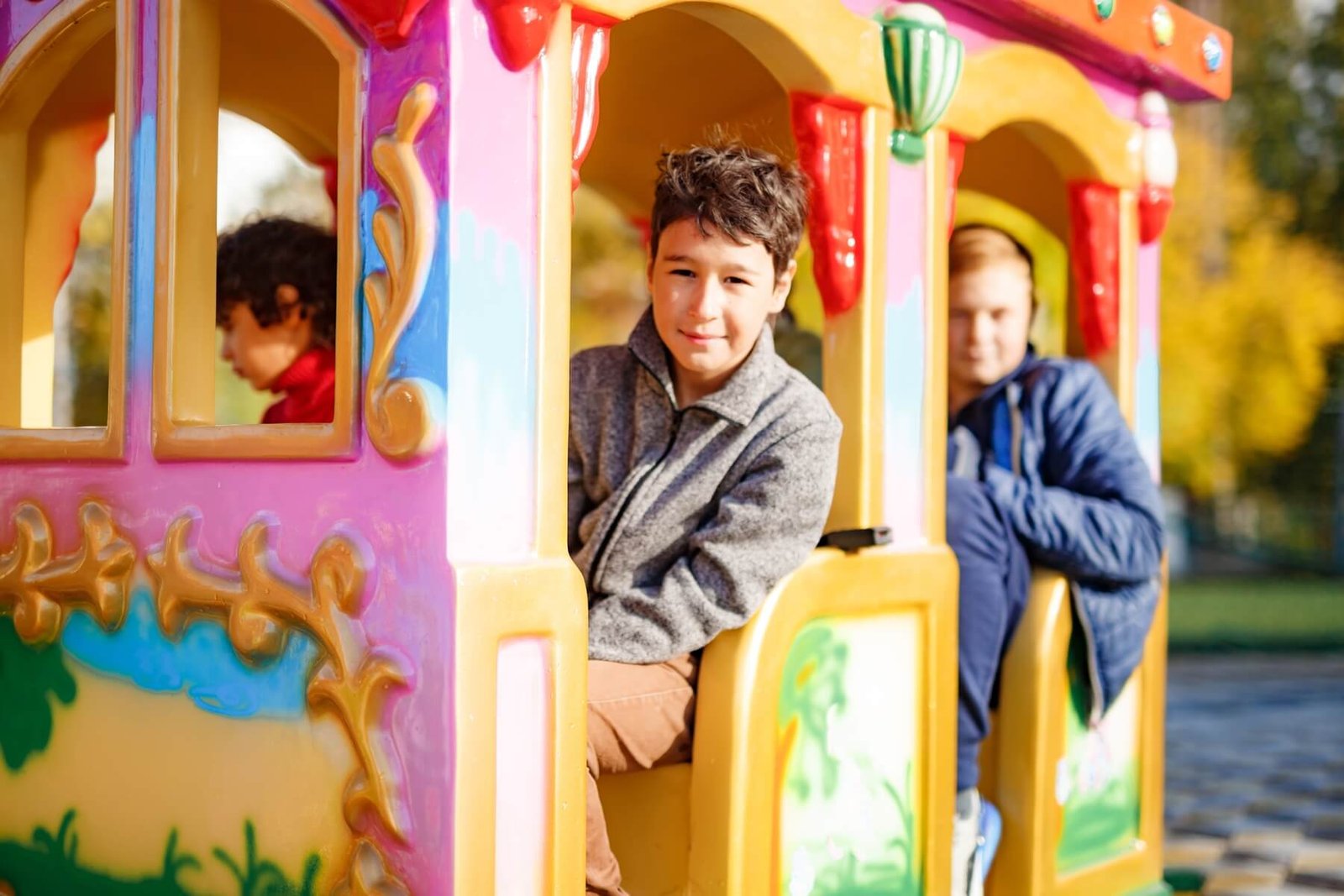 Boys Riding Train On Children Playground In City P 2023 11 27 05 27 17 Utc